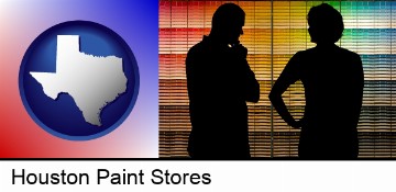 a couple looking at paint samples at a paint store in Houston, TX