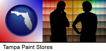 a couple looking at paint samples at a paint store in Tampa, FL